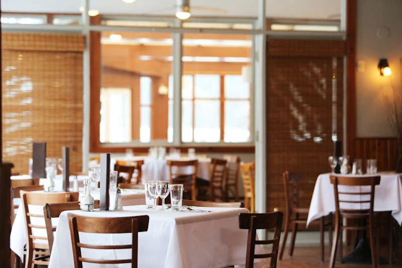 Restaurant interior with tables and warm lighting